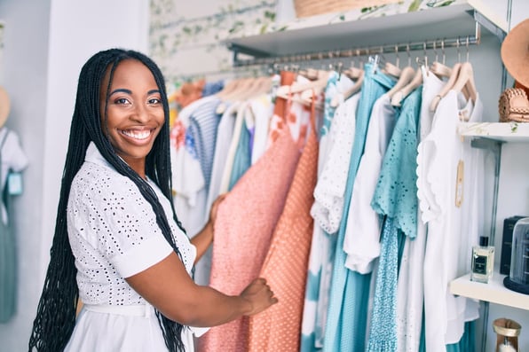 A small business owner smiling after getting approved for business financing